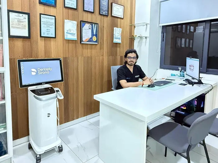 Dr. P. Sanjeev Varma, orthodontist, in his consultation room at Bay Dental Clinic with the Dentsply Sirona Primescan scanner