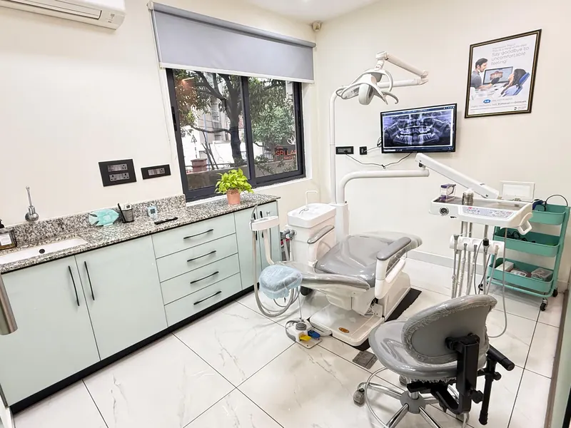 Dental treatment room with modern dental chair and digital X-ray display at Bay Dental Clinic, Vizag